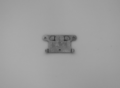 This metal piece can be applied to a wall.