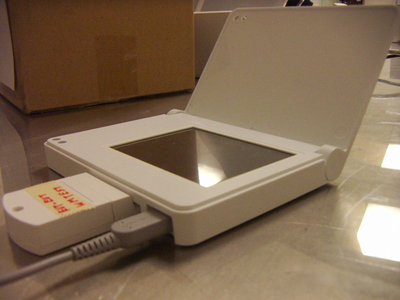 The front, with a cartridge inserted that says "EMC-EUT WMTest".