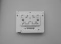 The plastic piece, screwed onto the Nintendo Zone Box.